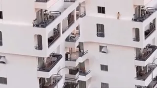Viral Video Of Toddler Walking On Wall's Edge From Multiple-Storey Window To Balcony Triggers Internet’s Anxiety